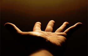 A hand with palm facing up, stretched out to signify outreach